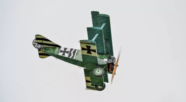 A German triplane flies overhead