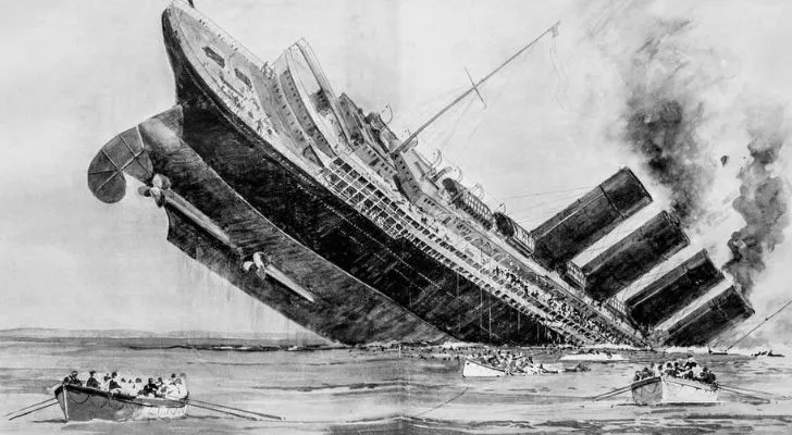 A huge ship with end lifting into the air as the other sinks into the ocean