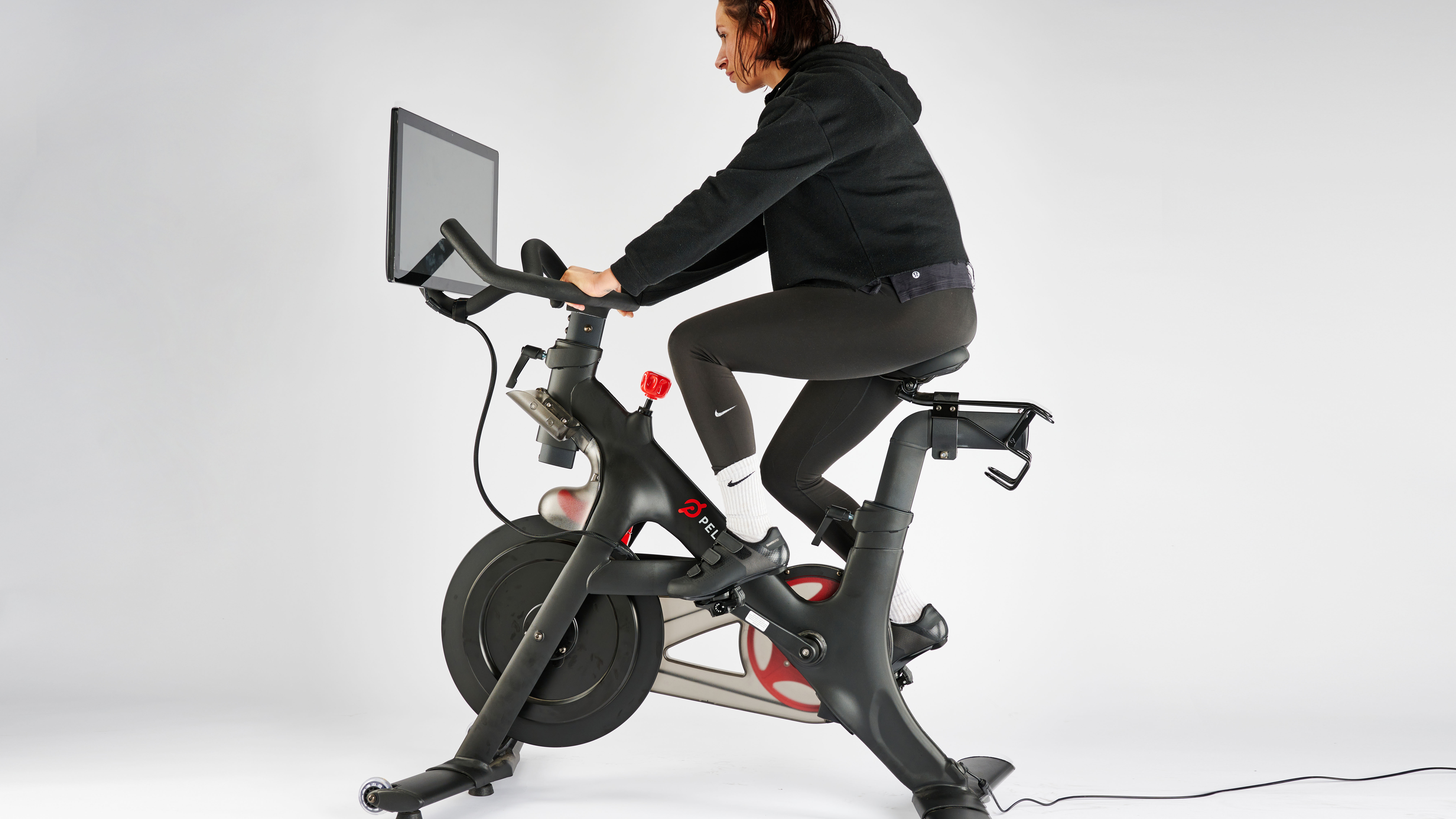 Peloton bike being tested by Sam Hopes, resident fitness writer at Live Science